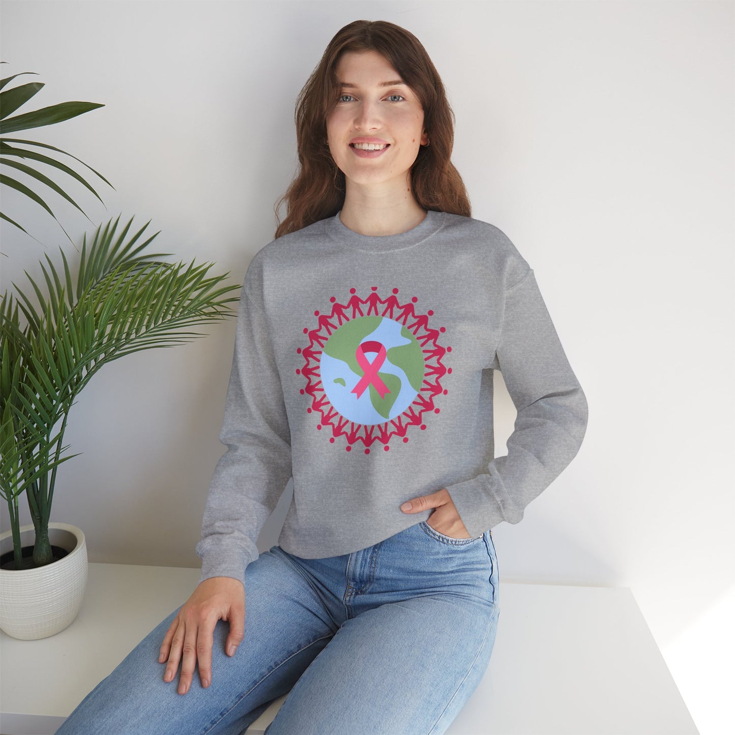 Unisex Heavy Blend™ Crewneck Sweatshirt Adult/Teen Activewear Image of Earth with Pink Stick figures Holding Hands for Breast Cancer Awareness