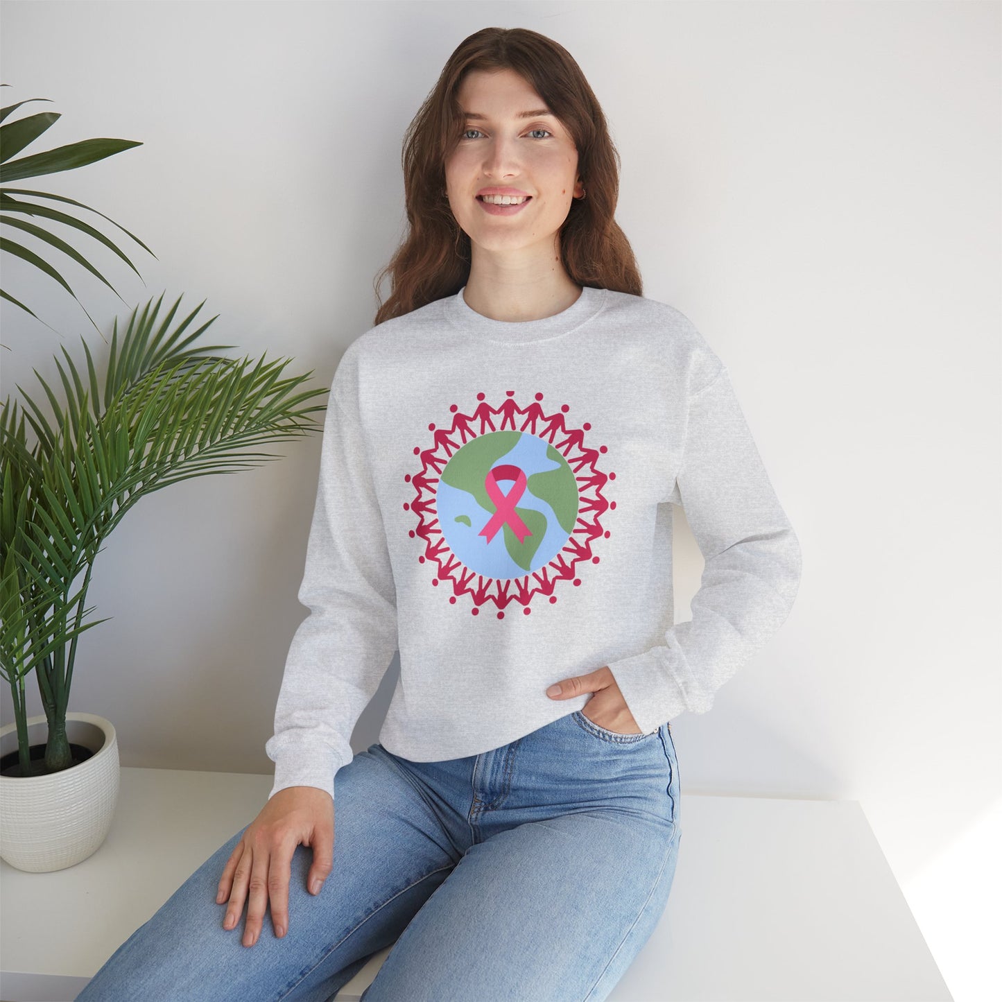 Unisex Heavy Blend™ Crewneck Sweatshirt Adult/Teen Activewear Image of Earth with Pink Stick figures Holding Hands for Breast Cancer Awareness